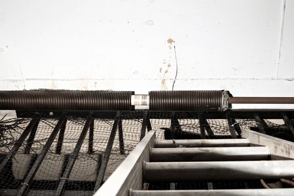 How to Respond to Broken Springs Cables or Off-Track Doors Safely